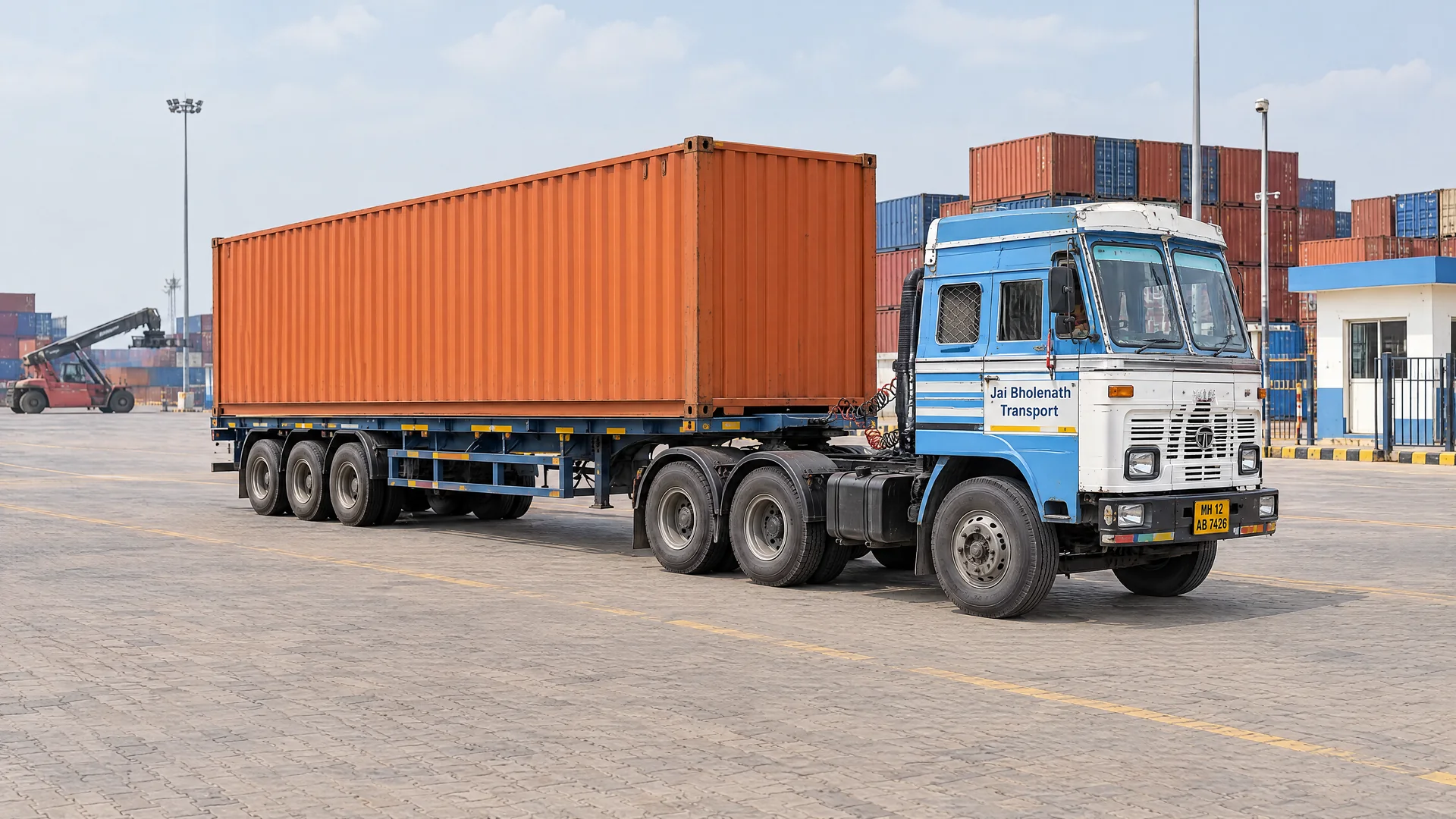 Illustration of an Indian tractor and skeletal trailer carrying a shipping container at a CFS